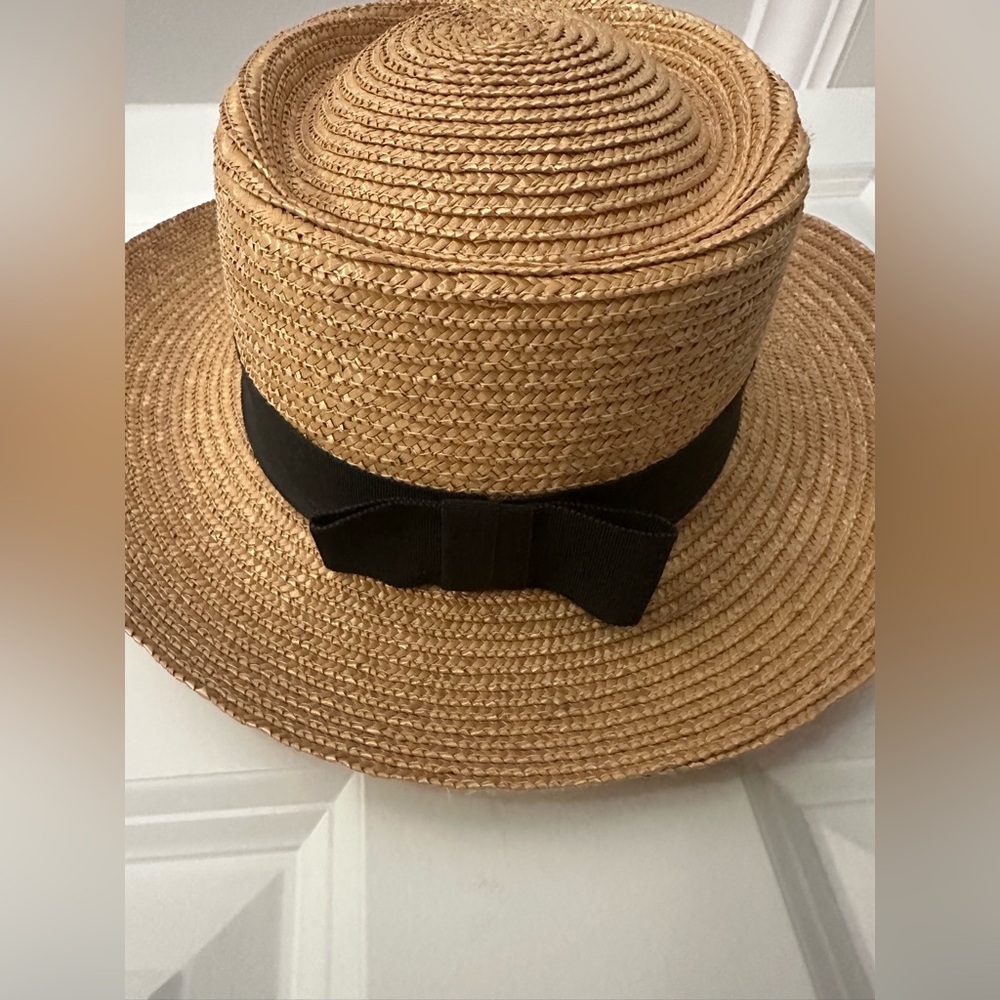 New Madcaps straw hat with black ribbon.  No flaws.  One size.